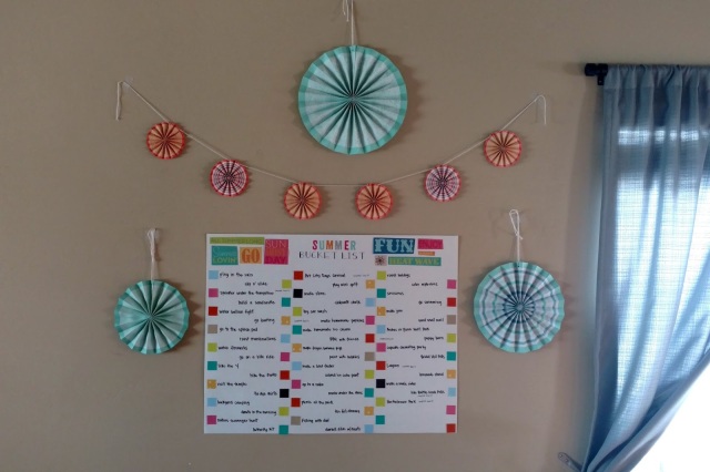 It's easy to make your summer bucket list a fun part of your decor with colorful paper fans.